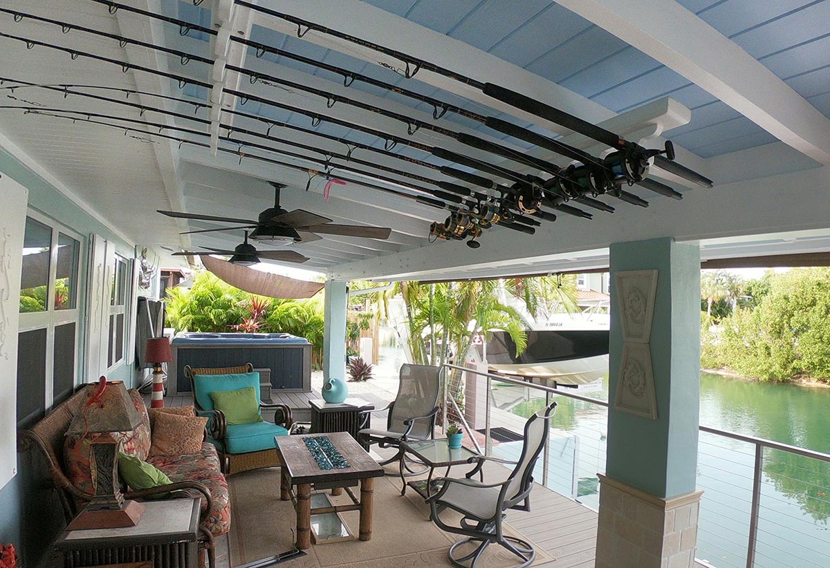 Back Porch Outdoor Living Room has plenty of seating for 10 and a place to hang your rods. Spa is shown in the background